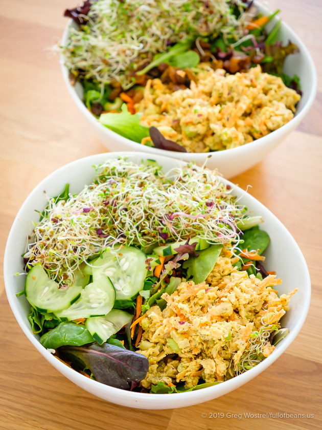 Better Than Tuna on top of a green salad in a large white bowl