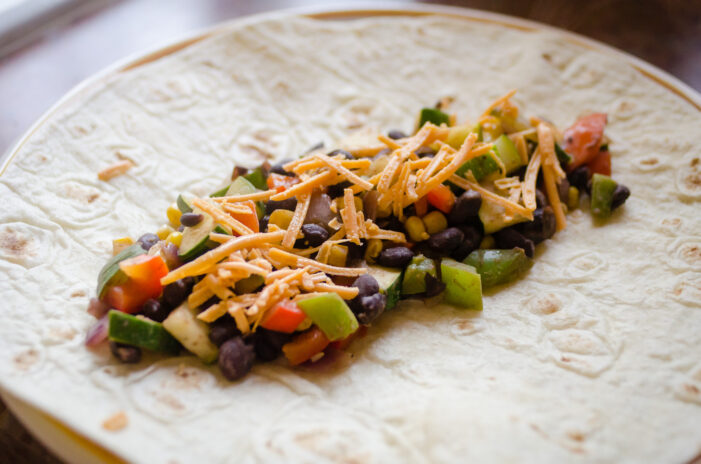 Filling for the veggie enchiladas on the tortilla