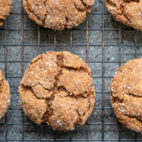 close view of molasses cookies on a cooling rack