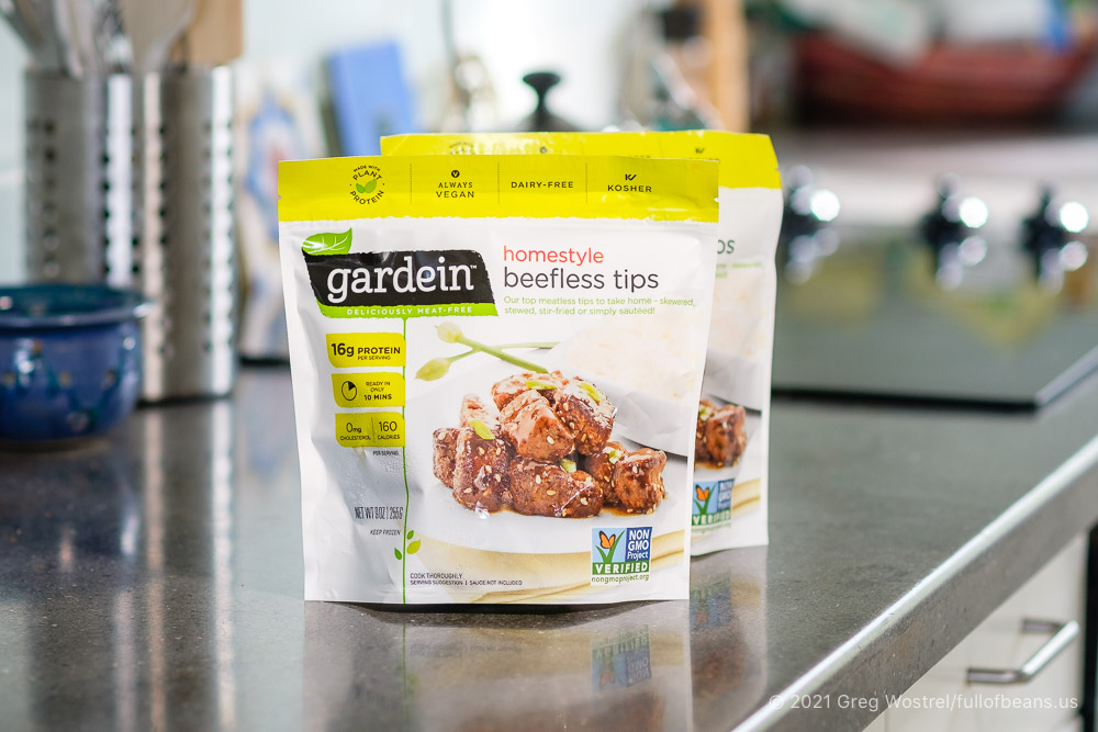 Two packages of Gardein Homestyle Beefless Tips on a kitchen counter