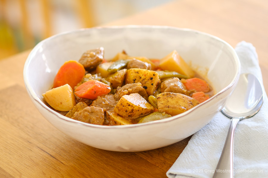 vegan beef stew in a white bowl