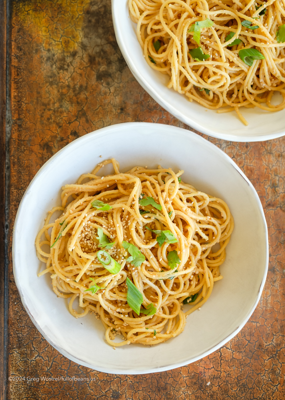 Spicy Sesame Peanut Ginger Noodles in a White Bowl