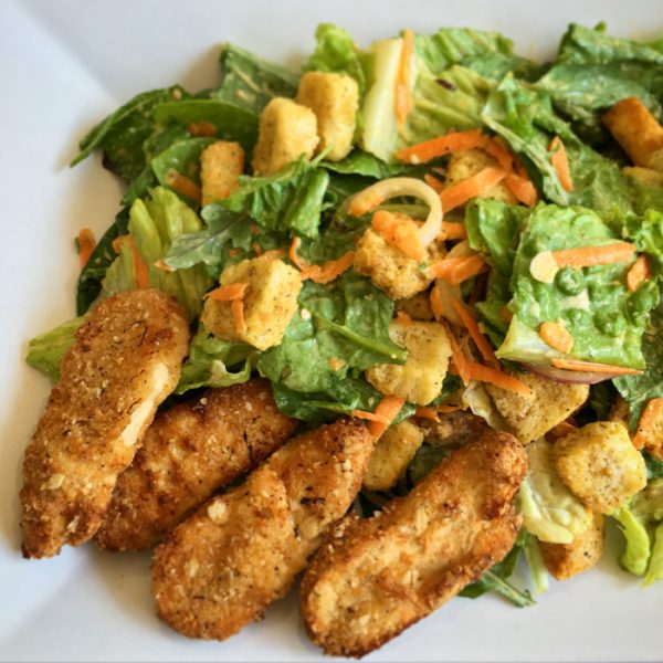 Air Fryer cooked Gardein Crispy Tenders with salad on a plate