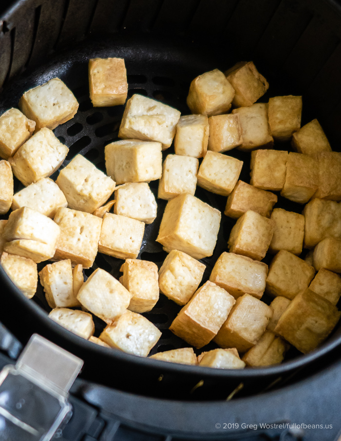 Crispy Tofu Cubes in Air Fryer Basket
