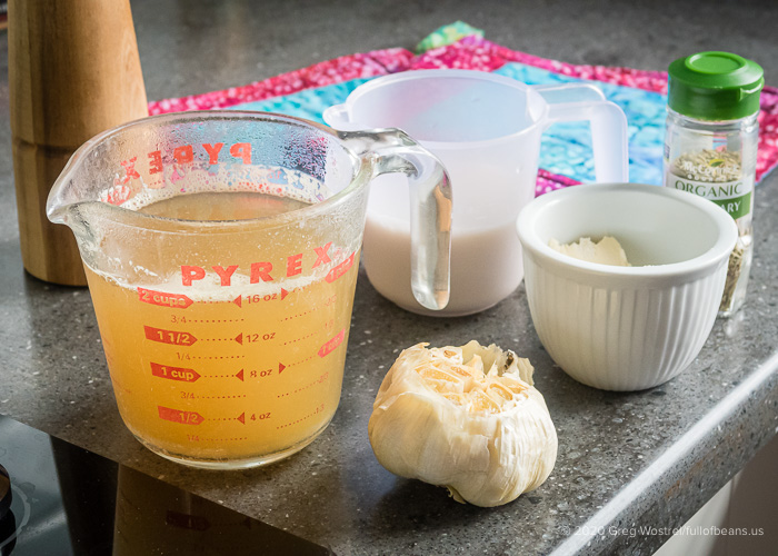 a cup of veggie broth, a head of roasted garlic, earth balance butter, rosemary, and almond milk