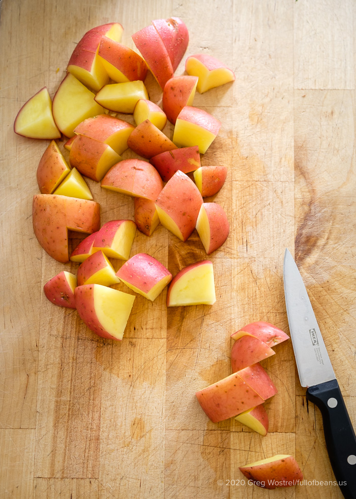 red potatoes cut and ready to make roasted garlic mashed potatoes