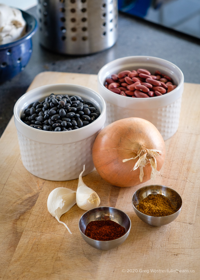 Ingredients for vegan refried beans: black beans & kidney beans, onion, garlic, cumin, chili powder