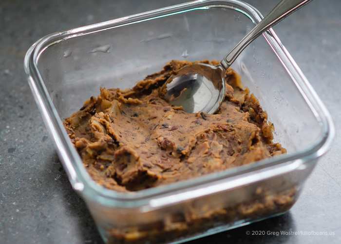 vegan refried beans in a glass dish