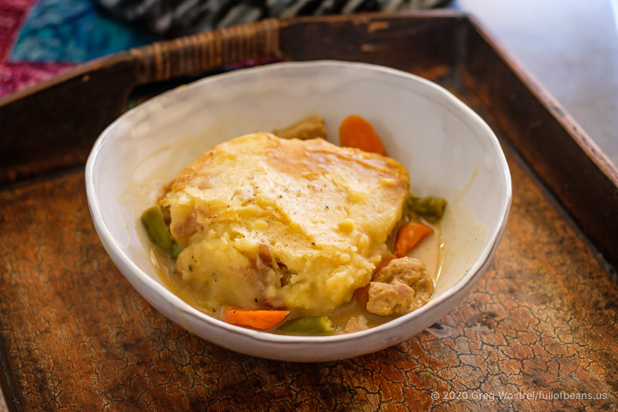 A serving of Vegan Shepherd's Pie in a white bowl