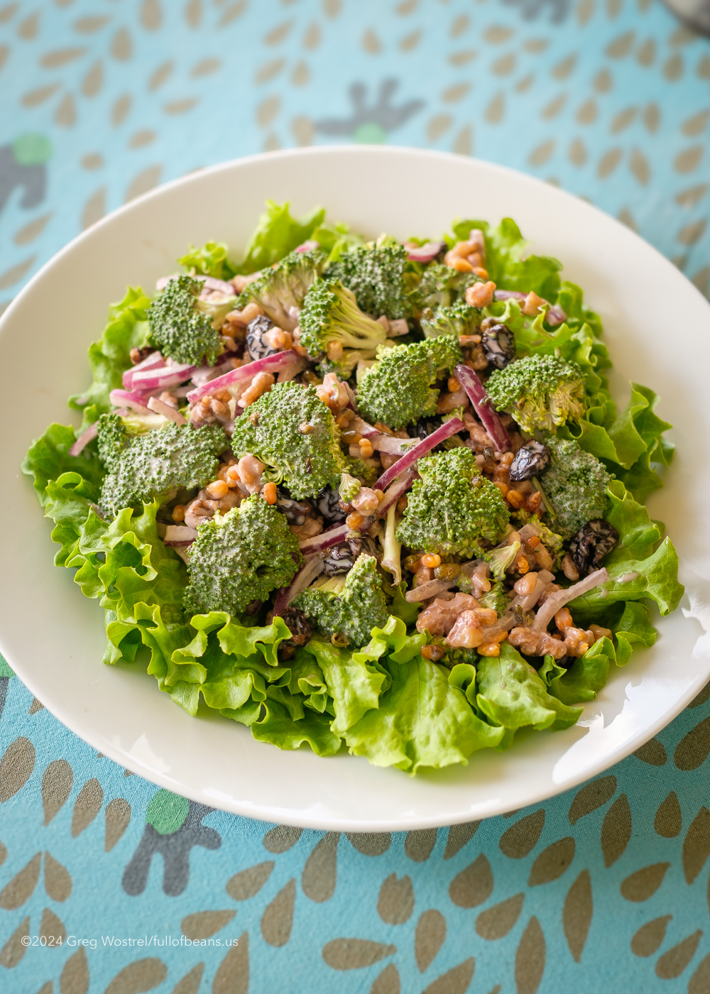 vegan broccoli salad in a white bowl